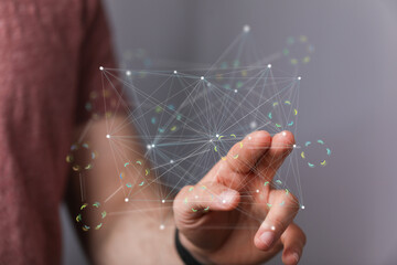 Image of a person interacting with a digital network, showcasing connectivity and technology.