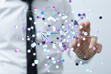 Abstract image of a businessman interacting with a digital network, representing global connections...