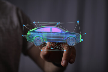 Person interacting with a digital car model.  Concept for automotive technology, innovation, and...