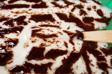 angle view melted chocolate outer with milk and blueberry flavors popsicle