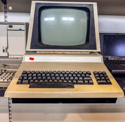 Retro computer monitor with keyboard in vintage technology exhibition. High quality photo