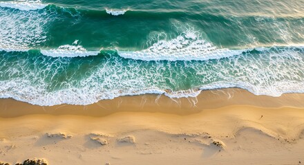 Emerald Waves Meet Golden Sand: A Lone Figure Walks on a Serene Coastline