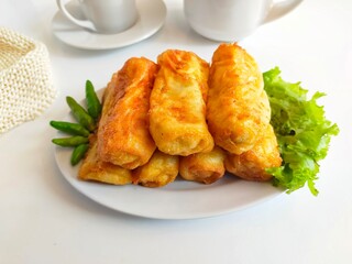 
Sosis Solo is Indonesian traditional fried egg crepe with sweet and minced chicken filling.