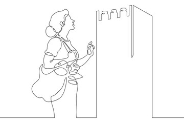 Continuous one line drawing woman chooses food products in a store.One continuous line isolated minimal illustration.Not AI.