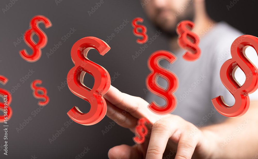 Poster abstract image of red paragraph symbols floating around a man's hand, representing legal concepts.