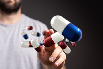 Stock photo of a man interacting with digital pills, perfect for healthcare, medicine, and...