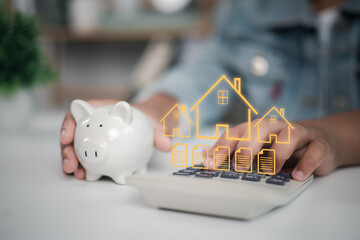 Mortgage, home loan planning, and real estate investment. Person calculating home payments using...