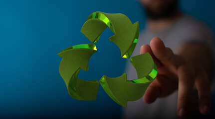 Person interacting with a 3D green recycling symbol. Eco-friendly concept.