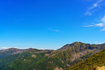Panoramic view of Ancares Valley in Bierzo showing green mountains and blue sky