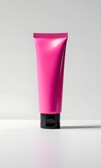 Pink cosmetic cream tube isolated on white background