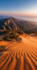 Fototapeta premium Desert mountain panorama at sunrise. Sandy slopes meet rugged peaks under a vibrant sky