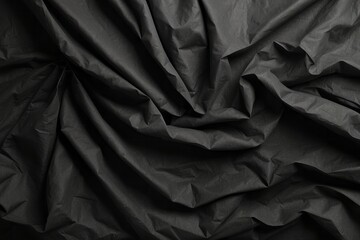 Wrinkled black old wrinkled paper. Dusty cardboard wrapping