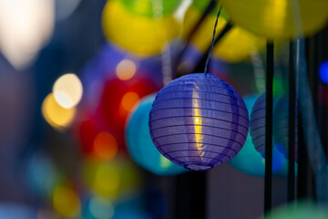 Colorful Hanging Paper Lanterns Illuminated at Night