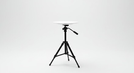 A camera stand holding a plate-like object at its top isolated on white