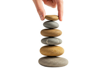 Balanced stack of river stones with hand on top creating harmony and balance. Cut out PNG