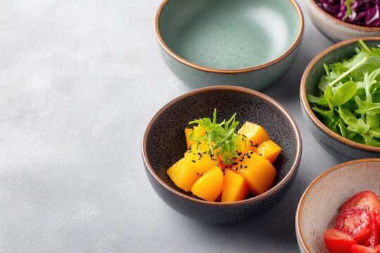 Colorful bowls filled with fresh ingredients create vibrant culi