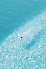 Endless blue water, swimmer gliding gracefully, serene waves, su