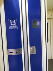 Blue toilet door in the train