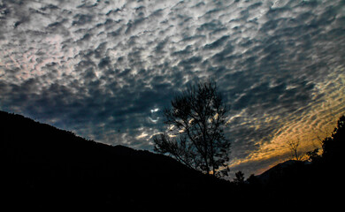 Clouds, Hills  Crimson Skies: Nepal’s Sunset Symphony
