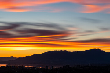 Fototapeta premium Sunset and sunrise views from Concord Brentwood Hillside East tower in Burnaby, BC, Canada