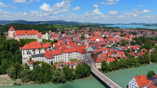 Drone video showing Fussen old town and Hohes Schloss castle in southern Germany 