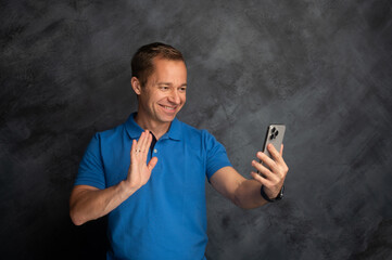 Middle Aged Man Expressing Emotions During a Phone Call