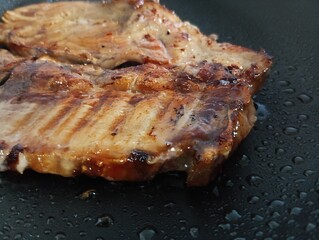 Grilled  steak on hot iron plate