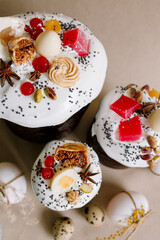 Traditional Easter cakes (kulich) with glaze, nuts, and dried fruits. Rustic still lifes with milk, eggs, willow branches, gift boxes, and festive decorations for Orthodox Easter celebration.