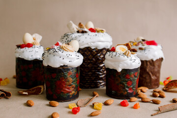 Traditional Easter cakes (kulich) with glaze, nuts, and dried fruits. Rustic still lifes with milk, eggs, willow branches, gift boxes, and festive decorations for Orthodox Easter celebration.
