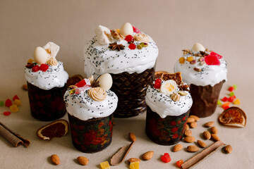 Traditional Easter cakes (kulich) with glaze, nuts, and dried fruits. Rustic still lifes with milk, eggs, willow branches, gift boxes, and festive decorations for Orthodox Easter celebration.