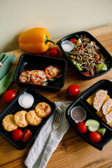 Healthy ready meals in eco and plastic containers: salads, soups, rice bowls, sandwiches and...