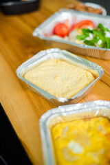 Healthy ready meals in eco and plastic containers: salads, soups, rice bowls, sandwiches and...