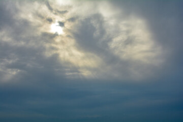 Heavily clouded, the sun tries to shine