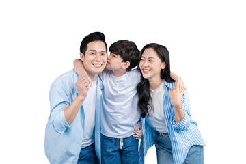 Fototapeta premium A family, embracing and full of love and happiness on a plain background. A child is kissing the father on his cheek