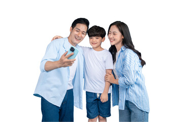 A happy family of three sharing a moment while looking at a phone. The parents are smiling,...