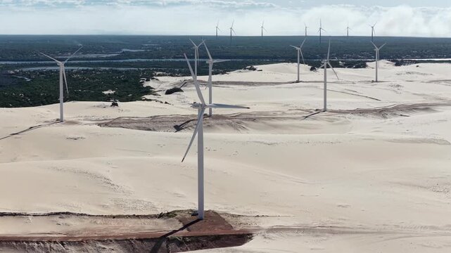 Wind turbines farm,  power generation equipment. Canoa Quebrada dunes, Brazil.