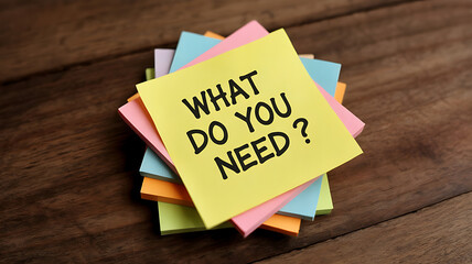 Colorful sticky notes ask "What do you need?".
