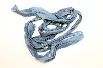 fabric tape lump. lying on a white background long fabric tape for decorating works