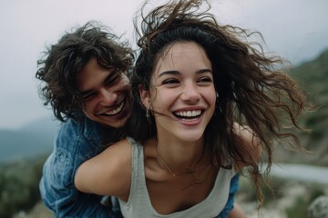 Carefree couple enjoying a piggyback ride on a scenic mountain path while laughing and embracing a joyful moment in nature