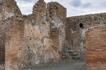 View of the ruins of a residential building in the ancient city of Pompeii.
