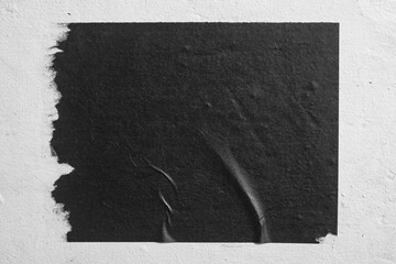 Close-up of black street poster.