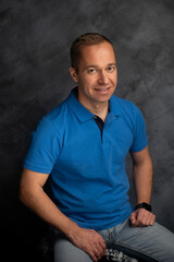 Confident Man Sitting and Looking at the Camera