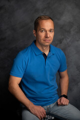 Confident Man Sitting and Looking at the Camera