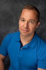 Confident Man Sitting and Looking at the Camera