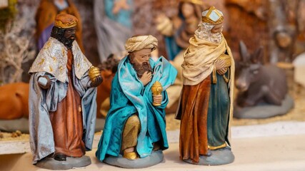 Clay figures representing the three kings of the east in a traditional nativity scene