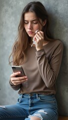 Thoughtful young woman checking her phone