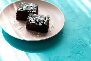 Vegan chocolate brownie on plate close up