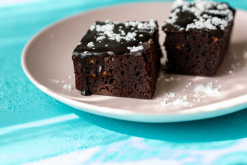 Vegan chocolate brownie on plate close up
