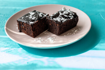 Vegan chocolate brownie on plate close up