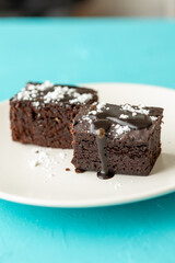 Vegan chocolate brownie on plate close up